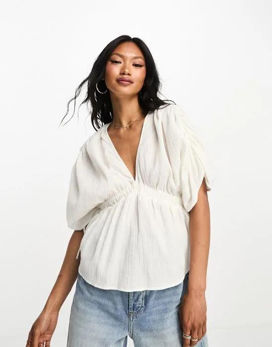plunge front crinkle top with tie side in white