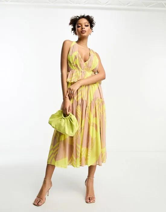 plunge pleated tiered midi dress in abstract print