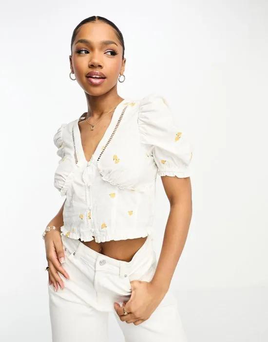 poplin tie front top in ivory with floral embroidery