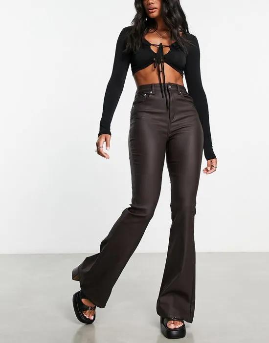 power stretch flared jeans in coated chocolate brown