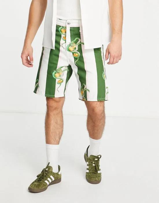 Premium denim shorts in green stripe with snake print