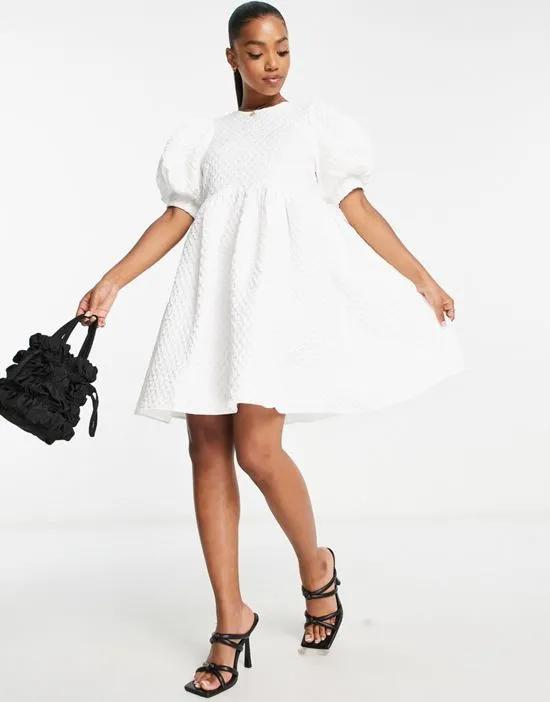Premium puff sleeve textured mini dress in white