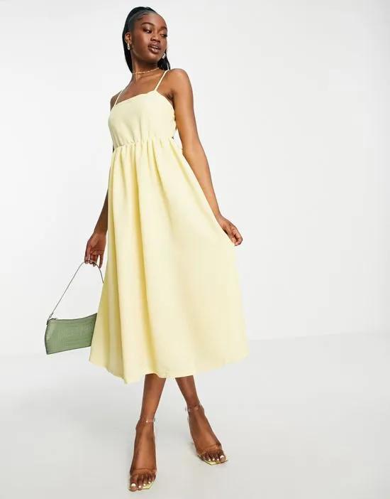 Premium textured open back midi dress in pale yellow
