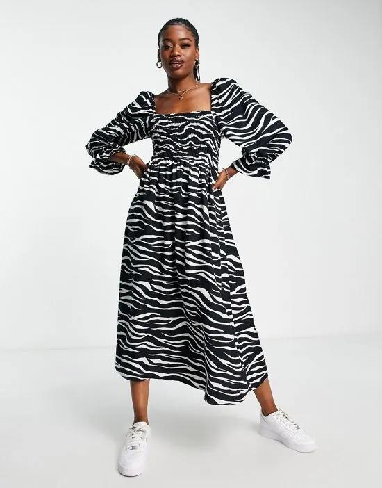 puff sleeve zebra print midi dress in black