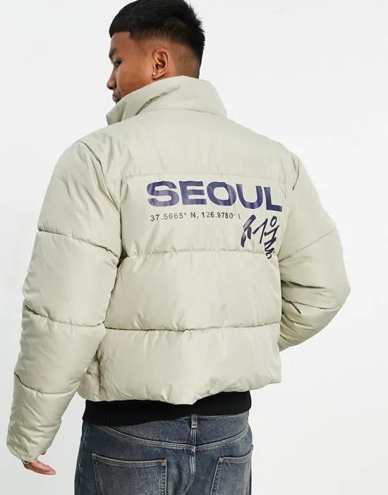puffer jacket in ecru with back placement print