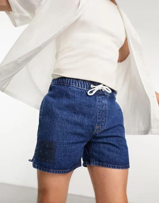 pull on shorter length denim shorts in mid wash blue