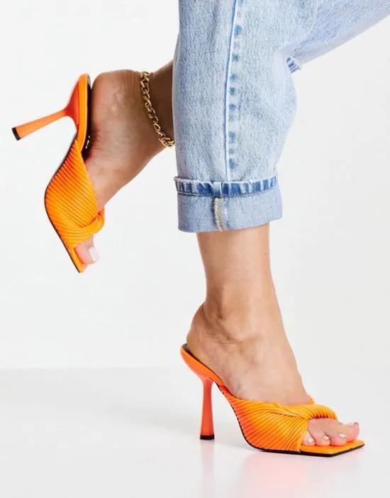 Punch heeled mules with twist strap in neon orange