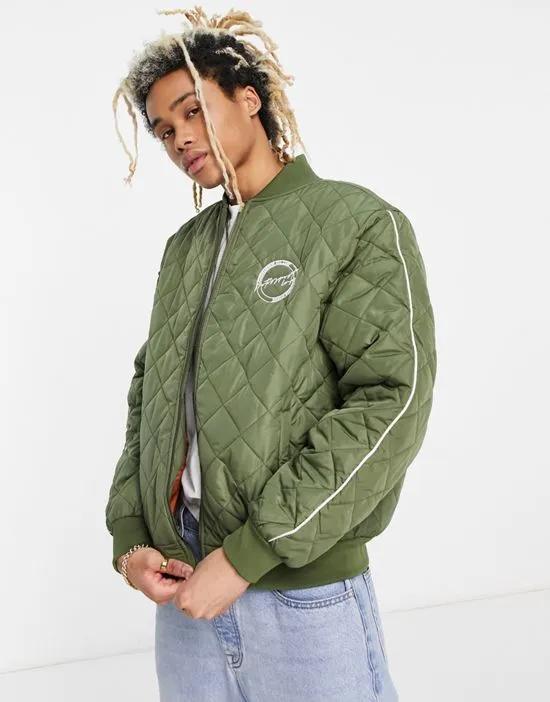 quilted bomber jacket in sage green with sleeve panels