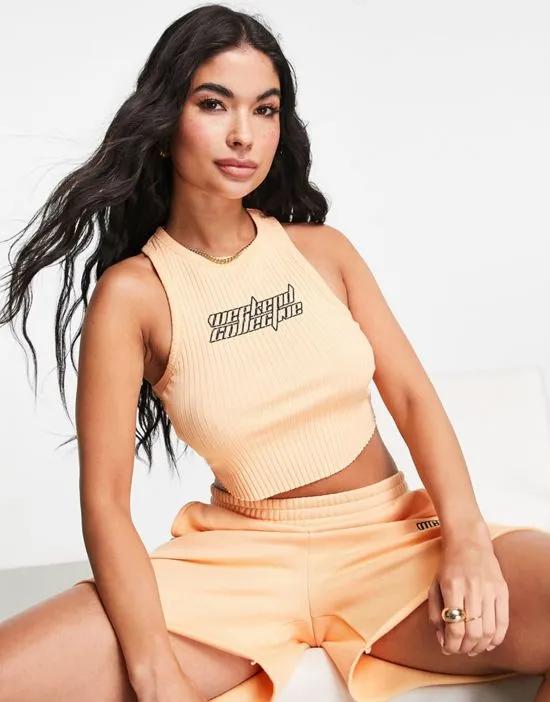 racer tank top with futuristic logo in apricot - part of a set