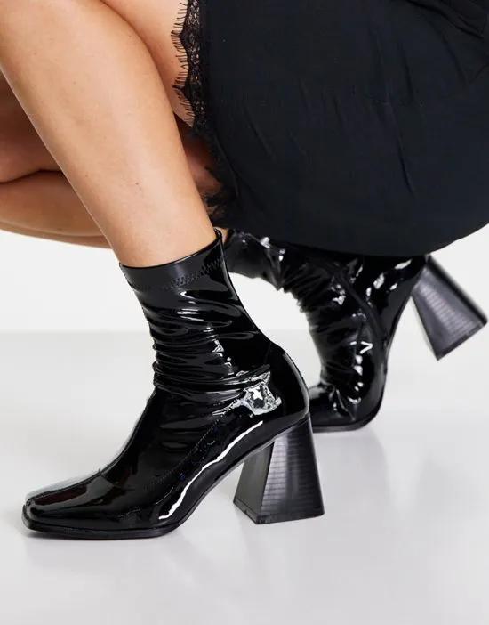 RAID Clever mid heel sock boot in black patent