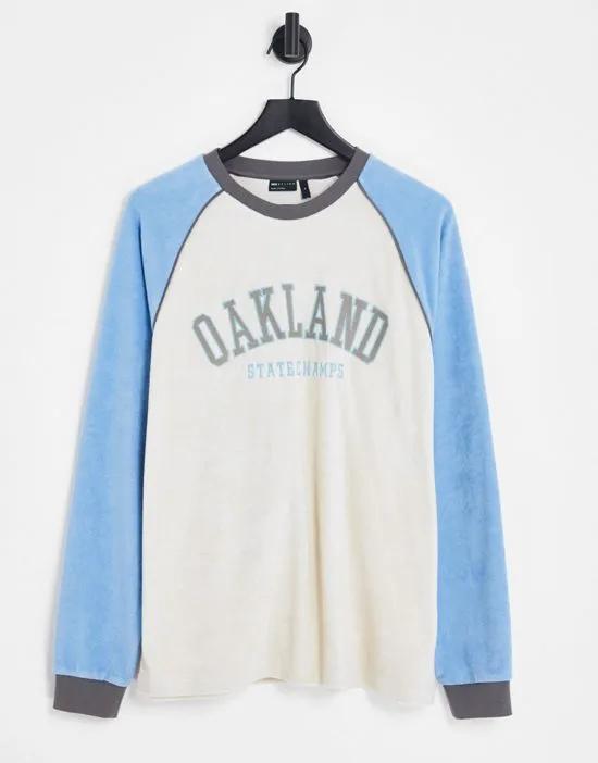 relaxed long sleeve t-shirt in neutral and blue towelling with Oakland city print