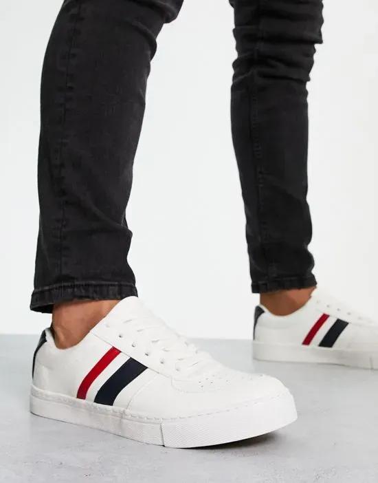 retro sneakers in white with navy and red stripe