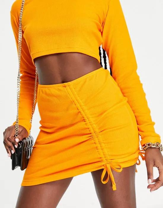 ribbed ruched detail mini skirt in orange - part of a set
