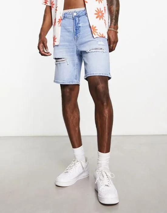 ripped denim shorts in mid blue