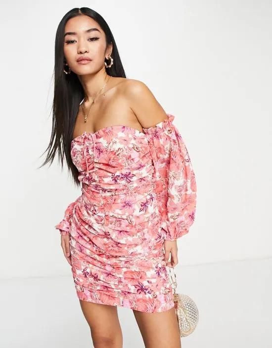 ruched bardot mini dress in bold pink floral