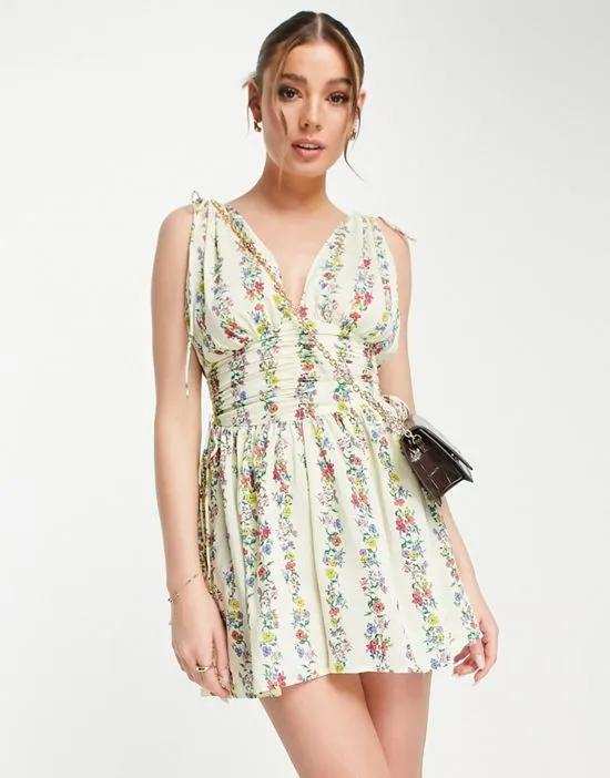 ruched flippy romper in linear floral