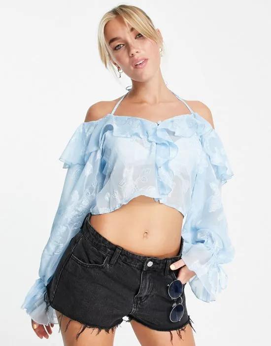 ruffle front blouse with tie in sheer blue jacquard