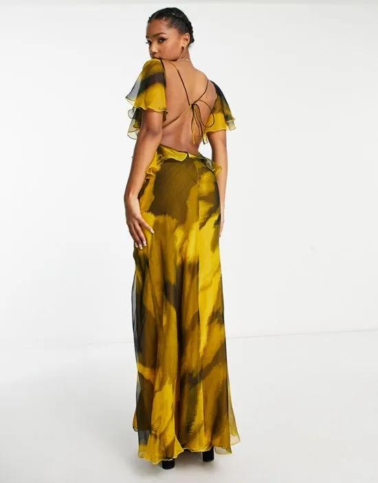 ruffle shoulder maxi dress with open back in abstract print in black and yellow