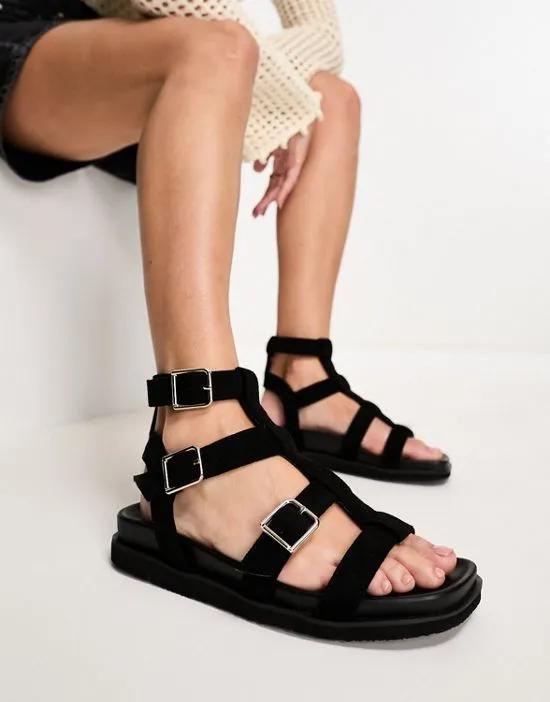 sancha gladiator buckle flat sandals in black