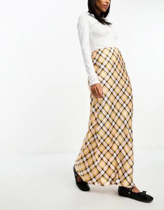 satin bias maxi skirt in pink and yellow plaid