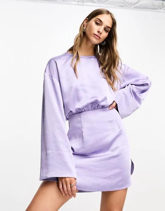 satin crew neck mini dress with dolphin hem and deep cuffs in lilac
