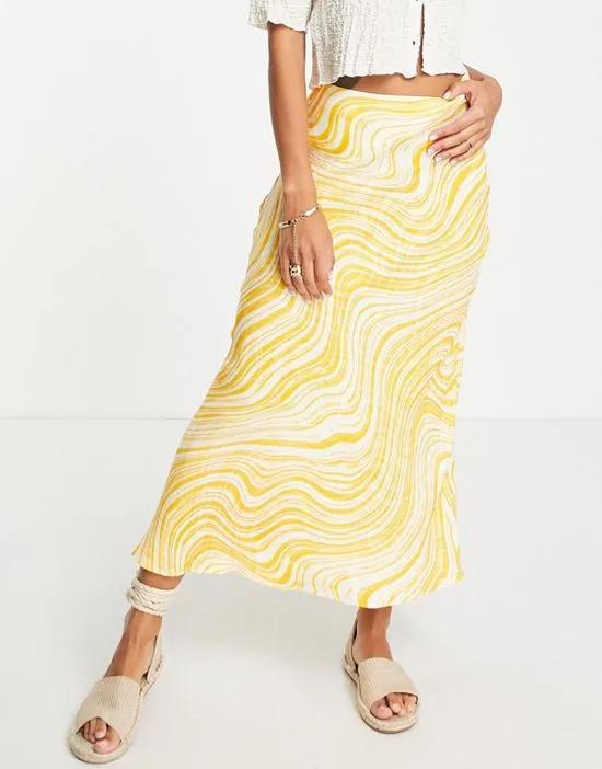 satin maxi skirt in yellow wavy print