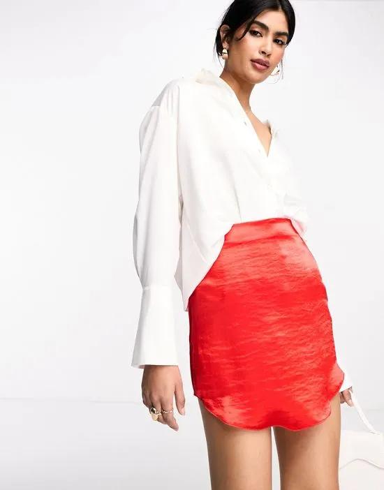 satin mini skirt with curved hem in red