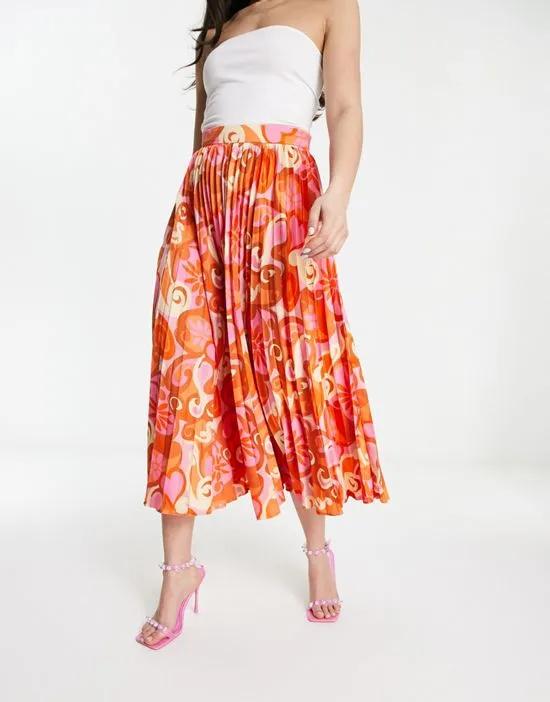 satin pleated midi skirt in bright pink abstract print