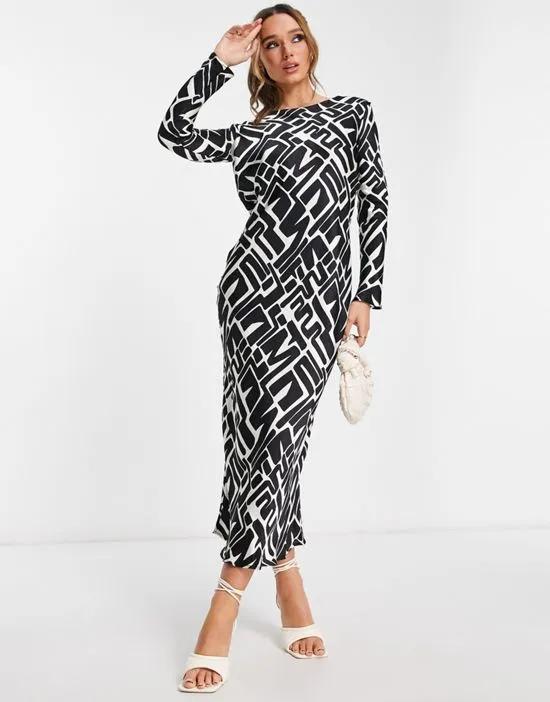 satin slip maxi dress in black and white geometric print