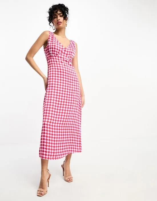 satin slip midi dress in pink checkerboard
