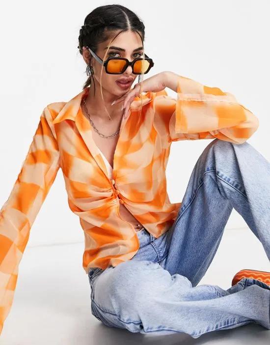 sheer slim fit shirt with frayed seams and ruching in orange checkerboard
