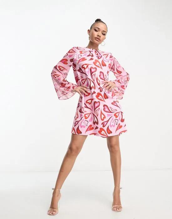 shift mini dress with bell sleeves in mixed heart print