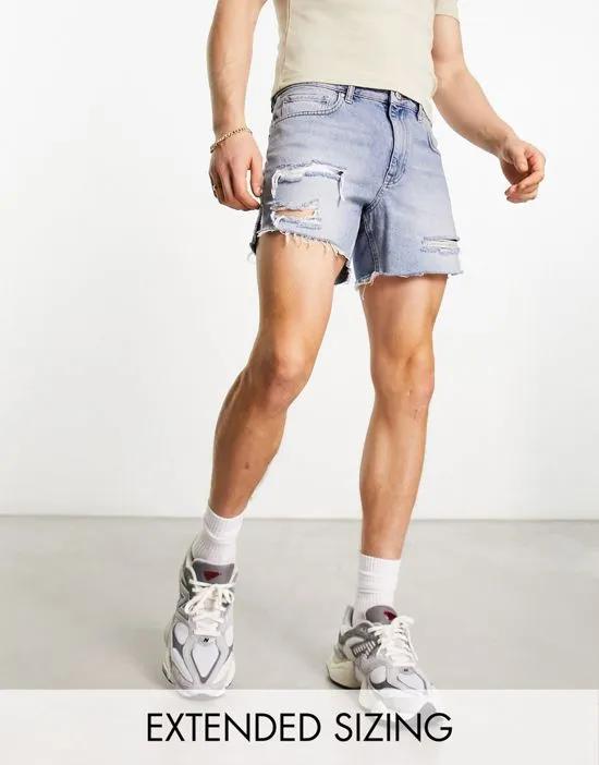 shorter length denim shorts with rips in light wash blue