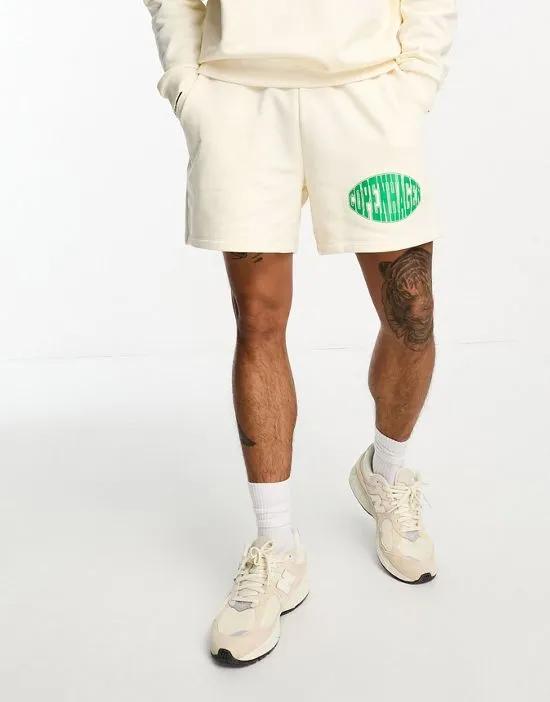 shorts in off white with collegiate print - part of a set