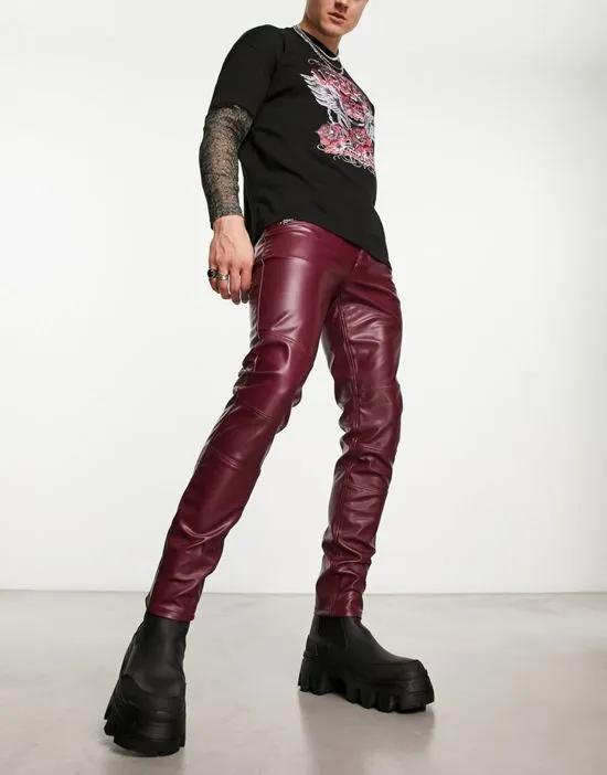 skinny faux leather jeans with zipper detail in burgundy