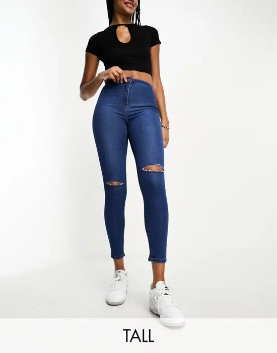 skinny jeans in mid wash blue