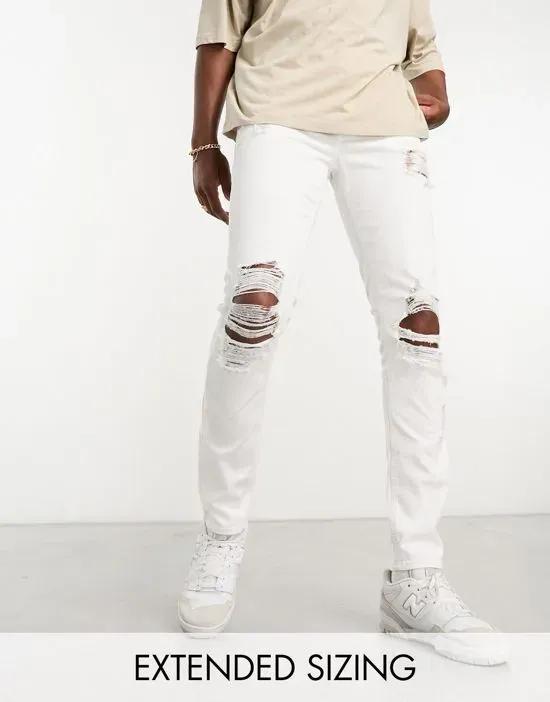 skinny jeans with heavy rips in white