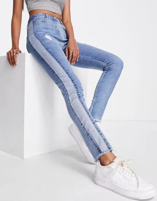 skinny jeans with panel detail in mid wash blue