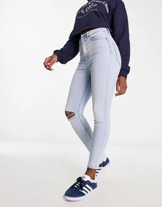 skinny jeans with rip in light blue