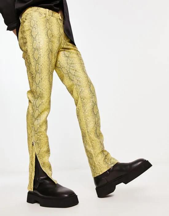 skinny leather-look pants in yellow snake print with zip detail