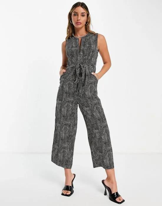 sleeveless jumpsuit in black and white speckle print