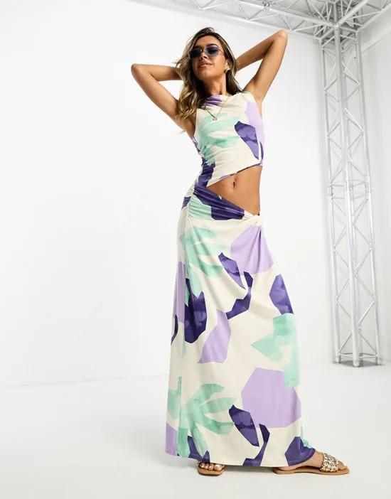 sleveeless maxi dress with cut out side in blue tonal print