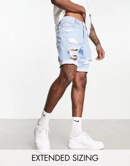 slim denim shorts with heavy rips in light wash blue