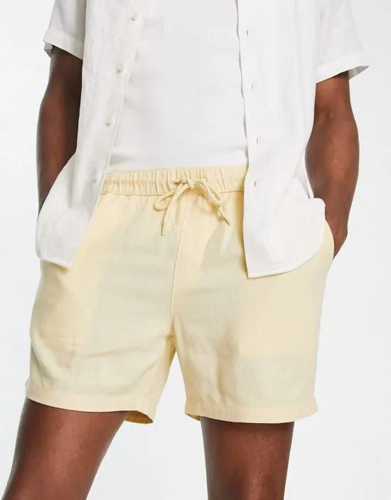 slim fit linen shorts in shorter length in beige