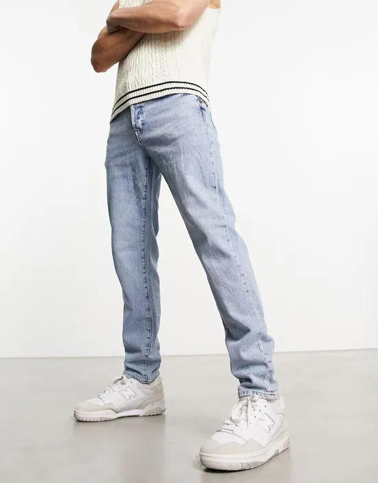 slim fit tapered jeans in light wash