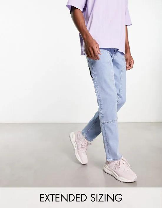 slim jeans with carpenter detail in light wash blue