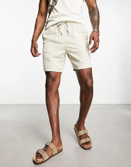 slim texture shorts in mid length in beige