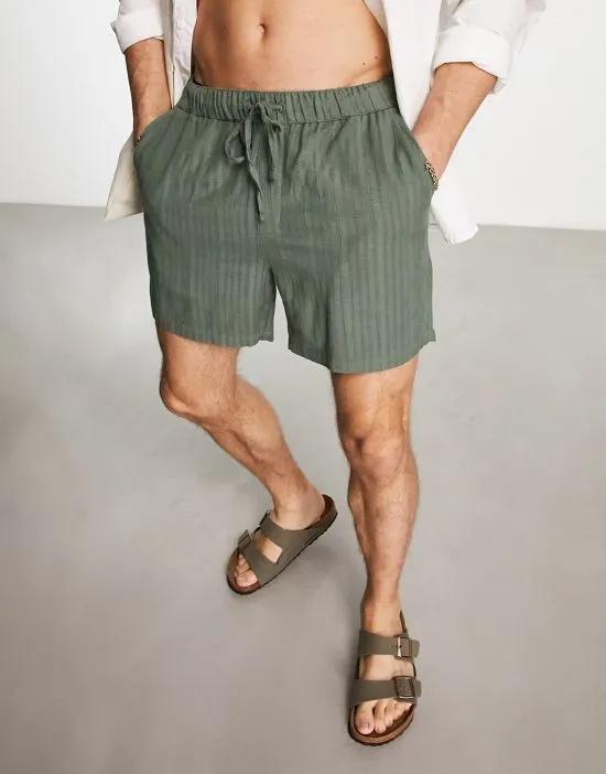 slim textured in shorts in shorter length in dark green