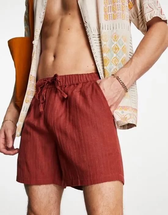 slim textured shorts in shorter length in orange