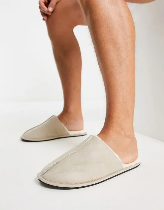 slip on slippers in stone with cream faux fur lining